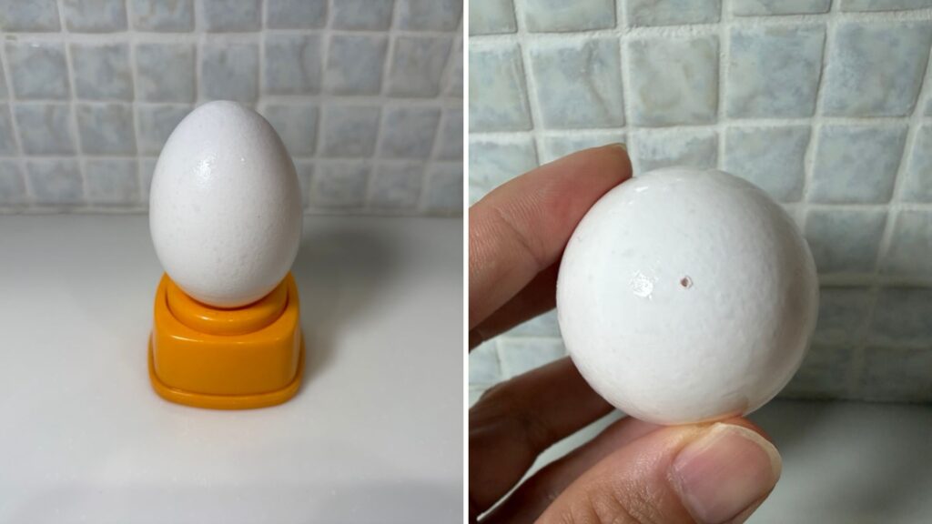 ゆで卵に穴を開けているところ